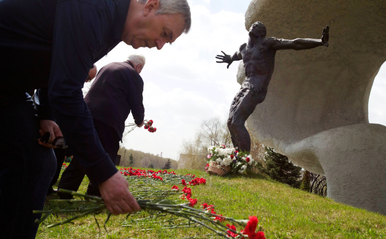 Russian veteran fire fighters lay flowers at Mitino Memorial to commemorate those who died after the Chernobyl 1986 nuclear disaster, in Moscow on April 26. Russians marked the 26th anniversary of the Chernobyl nuclear disaster, which was the world's worst ever nuclear accident.