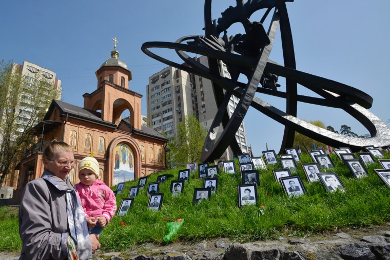 The widow of a victim holds a child during a ceremony, commemorating the 26th anniversary of the Chernobyl nuclear accident in Kiev, Ukraine, on April 26. On April 26, 1986 reactor number 4 blew apart at the Chernobyl power station. Facing nuclear disaster on an unprecedented scale Soviet authority tried to contain the situation by sending thousands of men into a radioactive area.