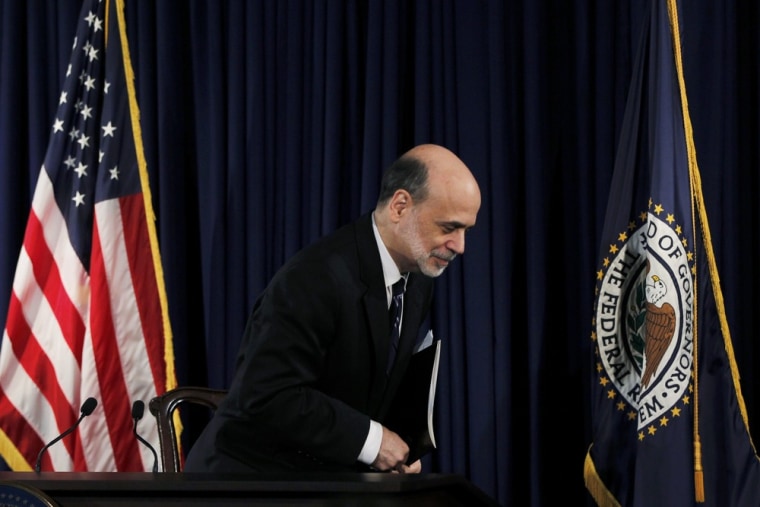 Watch that fiscal cliff. Fed chairman Ben Bernanke departs a news conference following the monthly two-day meeting at the Federal Reserve in Washington, April 25, 2012.