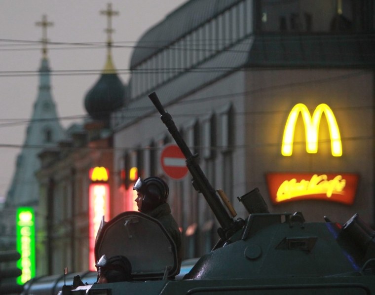 Russian military servicemen are pictured on top their armored personnel carrier as they travel down Tverskaya street to Red Square during the evening Victory Day parade rehearsal in Moscow on April 26. The parade, to commemorate the 67th anniversary of the capitulation of Nazi Germany in 1945, is scheduled for May 9.