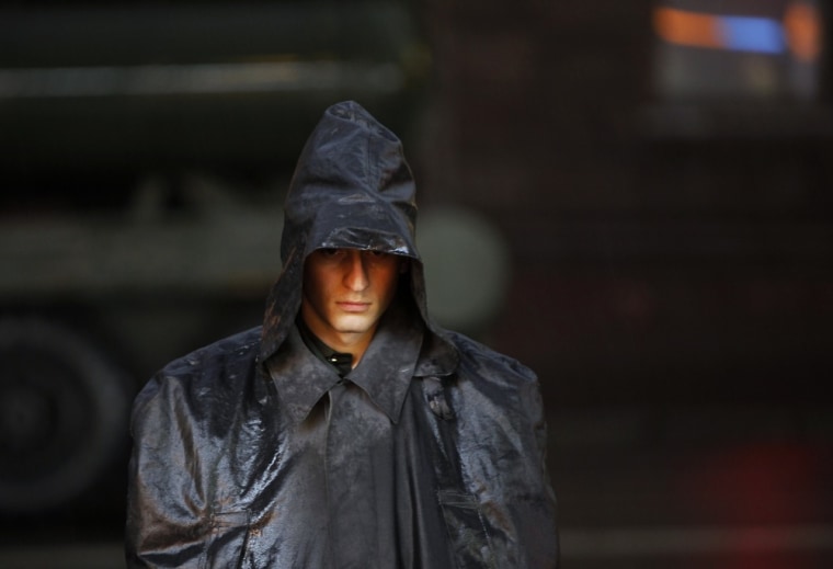 A Russian soldier stands guard in heavy rain during a rehearsal on April 26 for the Victory Day military parade in Moscow.