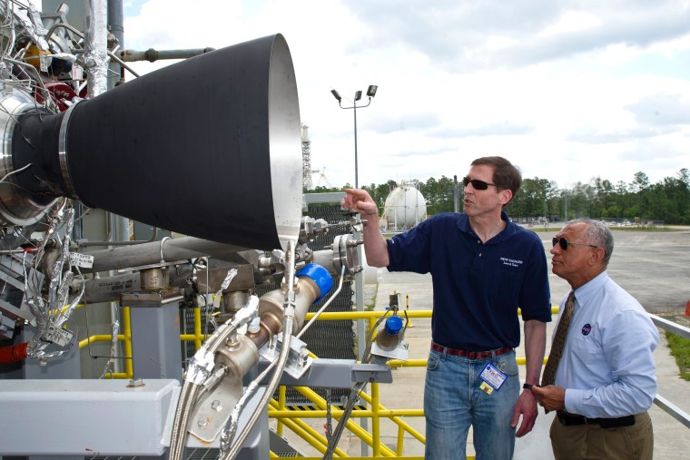 NASA Administrator Charles Bolden, right, discusses the upcoming testing of Blue Origin's BE-3 engine thrust chamber assembly with Blue Origin project manager Steve Knowles on the E-1 Test Stand at NASA's Stennis Space Center in south Mississippi.