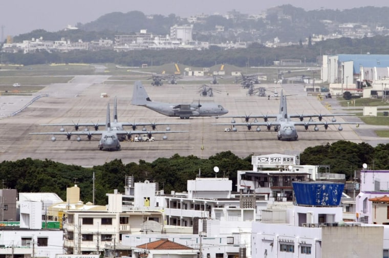 Hercules aircraft are parked on the tarmac at Marine Corps Air Station Futenma in Ginowan on Okinawa.
