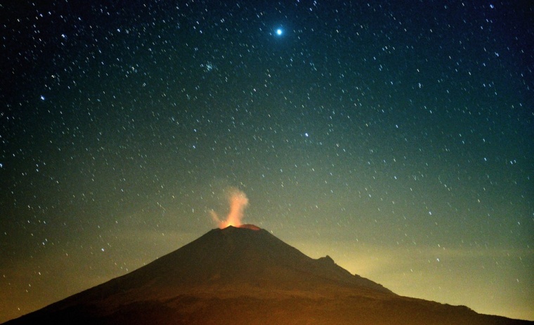 Incandescent materials, ashes and smoke are spewed from the Popocatepetl Volcano in Santiago Xalitzintla, in the Mexican central state of Puebla, on April 26, 2012.