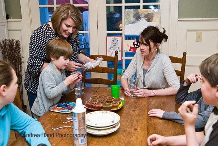Lindell, 5, unwraps a brownie that his preschool teacher brought to dinner.