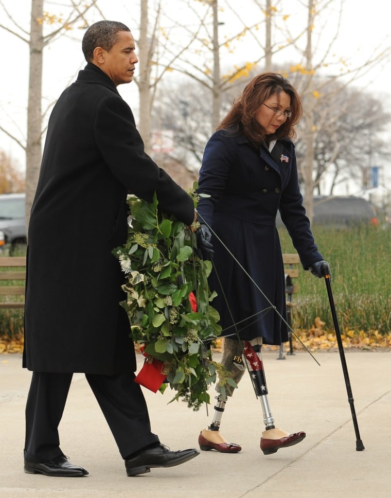 President Elect Barack Obama and Iraqi war veteran and Tammy Duckworth, place a wreath at The Bronze Soldiers Memorial in this file photo, November 11, 2008 on the Lakefront in Chicago, Illinois.