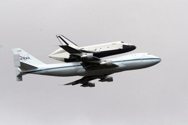 Space shuttle Enterprise, riding on the back of the NASA 747 Shuttle Carrier Aircraft, cruises over the Hudson River on Friday