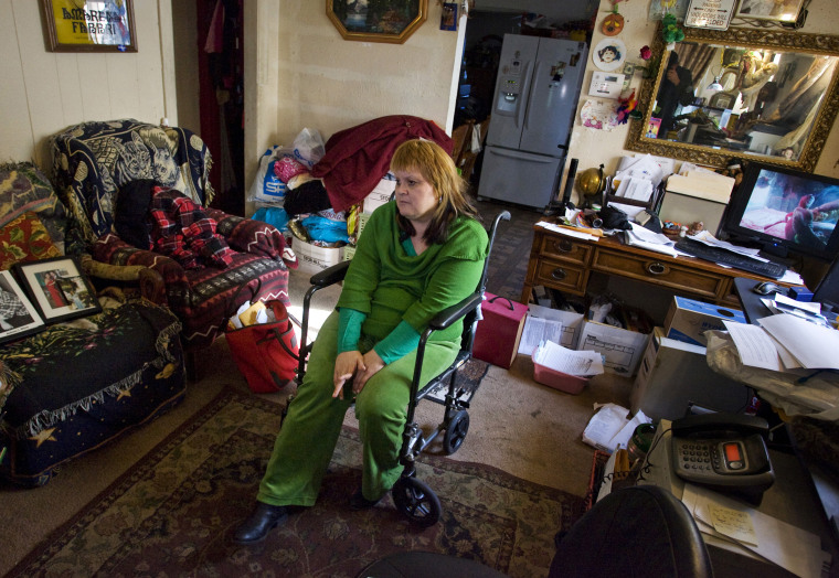 Ana Casas Wilson, who has cerebral palsy, sits in the living room of her South Gate, Calif. in December 2011. Wells Fargo has completed foreclosure on the home and eviction could be imminent, but Wilson refuses to leave, and argues that the foreclosure was unecessary.