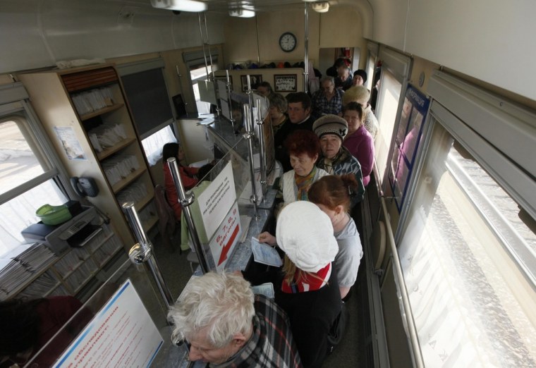 Patients stand in the registry line aboard the Doctor Voino-Yasenecky Saint Luka train, which serves as a free consultative and diagnostic medical center, at a railway station in Zaozyorny, Russia on April 27.