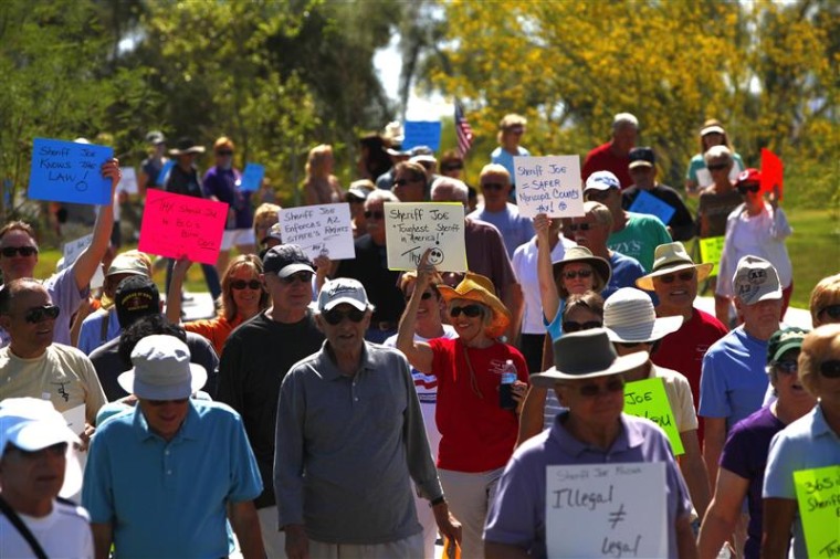 Supporters of Maricopa County Sheriff Joe Arpaio hold a rally at a park in Fountain Hills, Ariz., on Saturday.