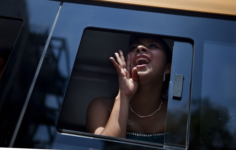 A 15-year-old girl shouts from the inside a bus during a mass Quinceanera.