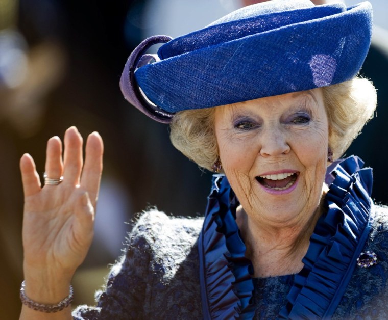 Queen Beatrix of the Netherlands waves to well-wishers in Rhenen on April 30, 2012.