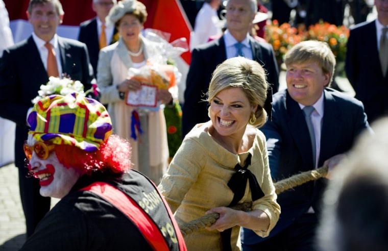 Princess Maxima and Crown Prince Willem-Alexander participate in the traditional tug-of-war event in Rhenen on April 30, 2012.