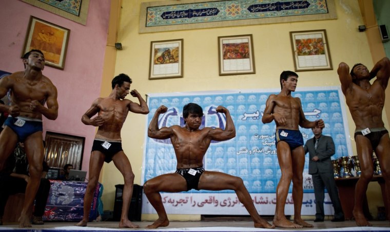 Afghan bodybuilders compete in the bantamweight classduring a regional bodybuilding competition in Kabul on April 30, 2012.