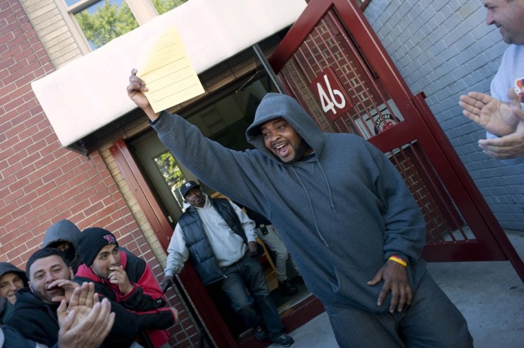 Job seeker Matthew Cox, the first person in line, cheers after picking up a job application form at the training offices of Local Union 46, a union representing metallic lathers and reinforcing ironworkers, in the Queens borough of New York on April 30. All images in this post photographed Keith Bedford of Reuters on April 30.