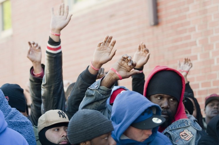 Job seekers raise their hands as the numbers on their wristbands, which they were given when they began queuing last week, are called after waiting in front of the training offices of Local Union 46.