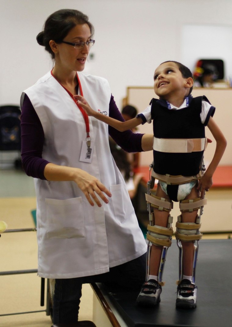 Rychard Barboso, 5, looks at his physical therapist during a session at the Association for the Aid of Disabled Children (AACD) in Sao Paulo on March 19. All images captured by Nacho Doce of Reuters.