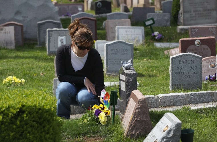 Maddalena Sullivan visits a grave on the two-month anniversary of the death of her cat Spanky.