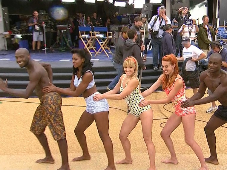 Beach volleyball dancers do the conga!