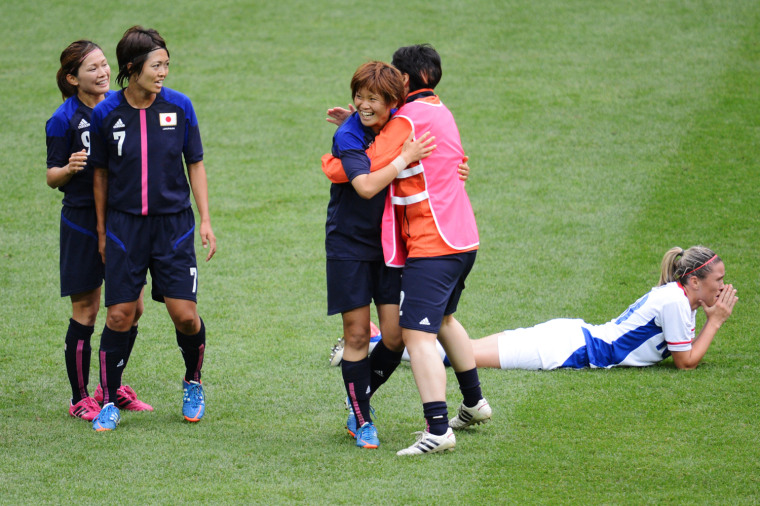 A moment of true sportsmanship, as Japan consoles a defeated France