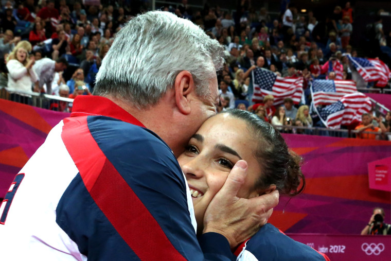 Alexandra Raisman of the United States hugs coach Mihai Brestyan after winning the gold medal for the Artistic Gymnastics Women's Floor Exercise final on Day 11 of the London 2012 Olympic Games at North Greenwich Arena on Aug. 7, in London, England.