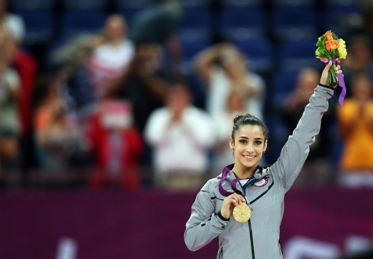 Alexandra Raisman of the US celebrates with her gold medal in the women's floor exercise at the London 2012 Olympic Games Artistic Gymnastics, on Aug. 7.
