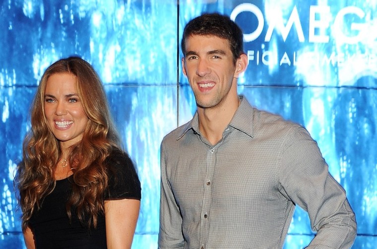 Natalie Coughlin, left, and Michael Phelps attend \"Spotlight On Swimming\" at OMEGA House at The House of St. Barnabas on Tuesday, Aug. 7 in London.