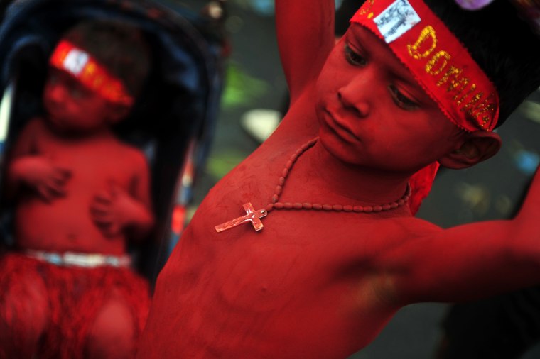 Painted children take part in the festivities honoring Santo Domingo de Guzman, Managua's patron saint on Aug. 10.