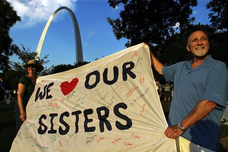 Joe Koerner and his wife, Maria Allen Koerner, of St. Louis, rally with other supporters of The Leadership Conference of Women Religious (LCWR) at a vigil Thursday in St. Louis.