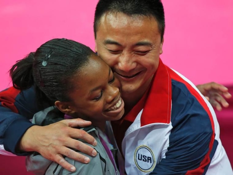 Gabby Douglas' coach Liang Chow, born and raised in China until his studies and gymnastic skills brought him to the University of Iowa. (AP Photo/Matt Dunham)