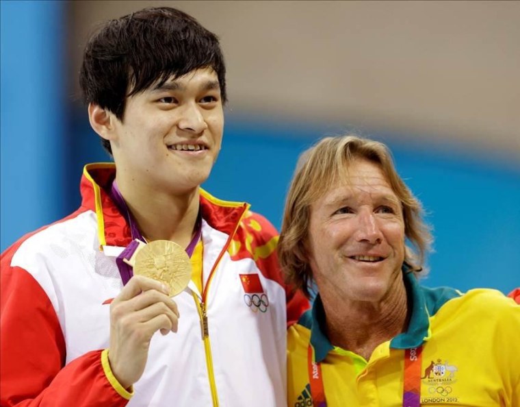 Celebrated Australian swim coach Denis Cotterell with China's Sun Yang who won the gold in the 1500m. (AP Photo/Lee Jin-man)