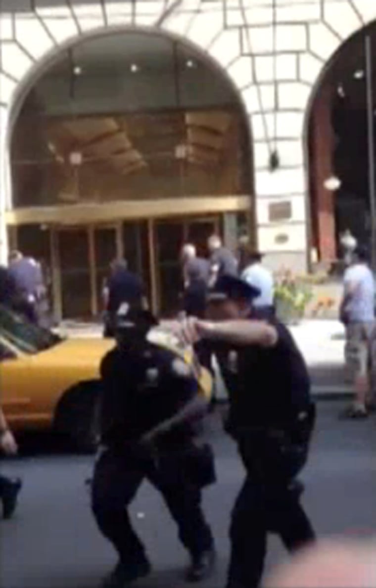 Cell phone video shows police chasing a man they shot near Times Square Saturday afternoon.