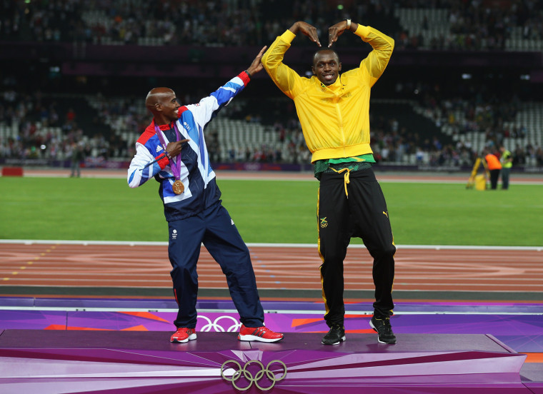 Jamaica's Usain Bolt celebrates next to teammate Asafa Powell after... News  Photo - Getty Images