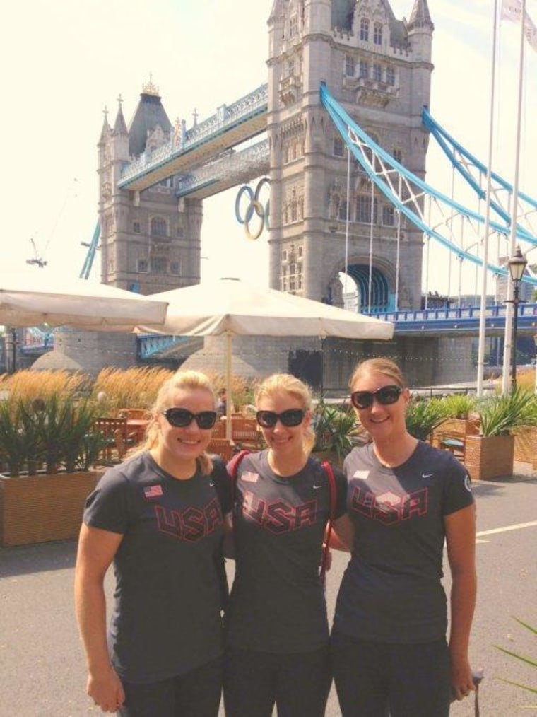 American track cycling silver medal winners Jennie Reed (L), Sarah Hammer and Lauren Tamayo (R) in front of London's Tower Bridge, Saturday.