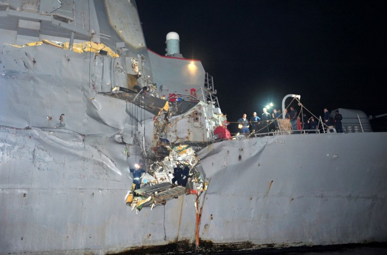 A handout picture released by the US navy shows the damaged destroyer USS Porter following a collision with a bulk oil tanker in the Strait of Hormuz on Sunday.