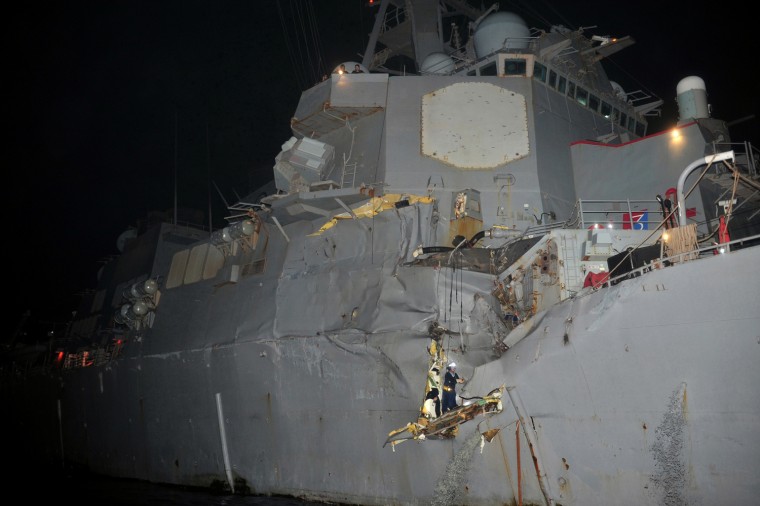 Guided-missile destroyer USS Porter (DDG 78) is seen after a collision with the bulk oil tanker M/V Otowasan in the Strait of Hormuz, Aug. 12. No one was hurt and shipping traffic in the waterway, through which 40 percent of the world's seaborne oil exports pass, was not affected, officials said.