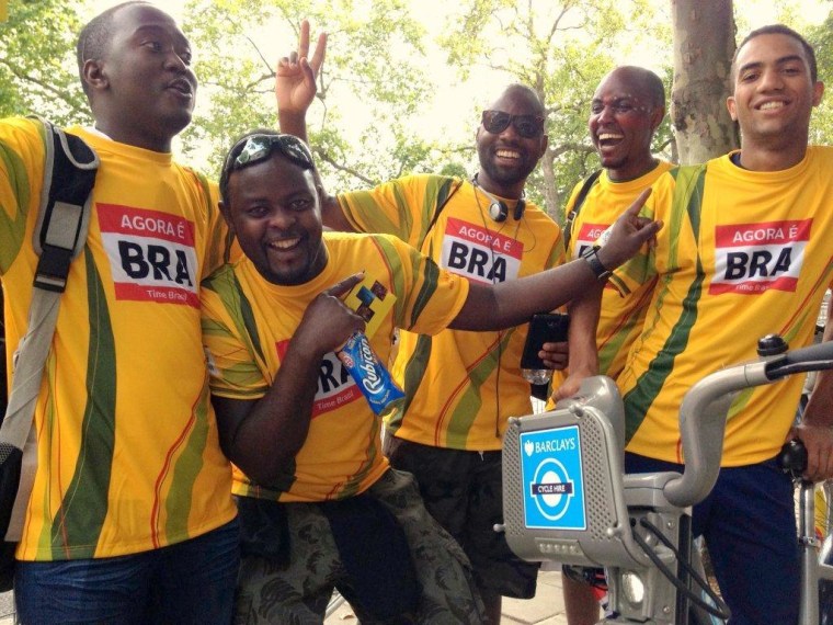Philip Nagenda, Jospeh Kiwalabye and Ronald Mukasa from Uganda, Martin Kimani from Kenya and Fabrice Jean from Canada trying out one of London's free bicycles while wearing promotional Rio 2016 shirts outside Casa Brasil at London's Somerset House, Sunday.