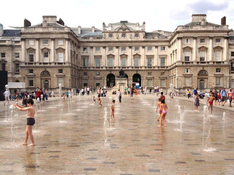 Children play in the fountains on Sunday afternoon at Casa Brasil, the temporary exhibition space set up at London's historic Somerset House to promote the forthcoming Rio 2016 Olympic Games.