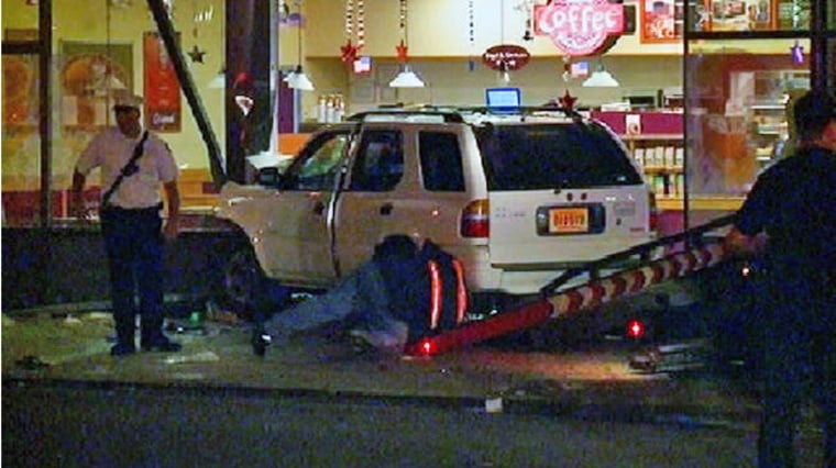 This image taken from video shows an SUV after it plowed into a Dunkin' Donuts store in Jersey City on Monday.