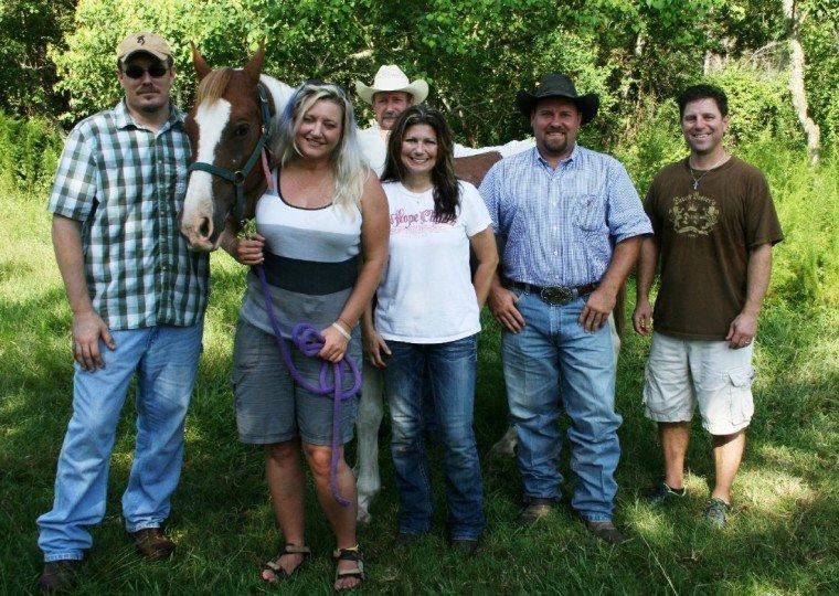 Michelle Pool is pictured handling her horse Opie with the support of friends and family. Shown left to right, front row, are Jeff Wilson, Michelle Pool, Deanna Bordelon, Chance Ward and Brent Bordelon. Standing behind the horse is Pool's father, Andrew Pool.