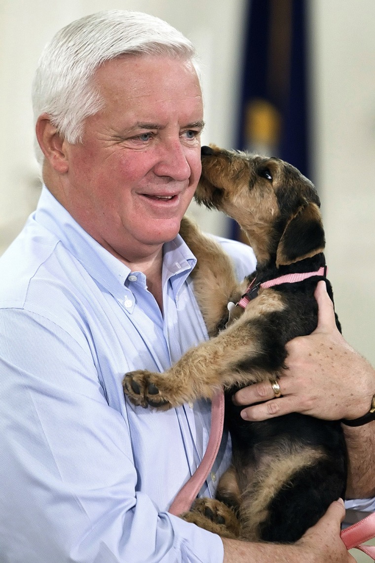 Pennsylvania Gov. Tom Corbett gets a kiss from one the new