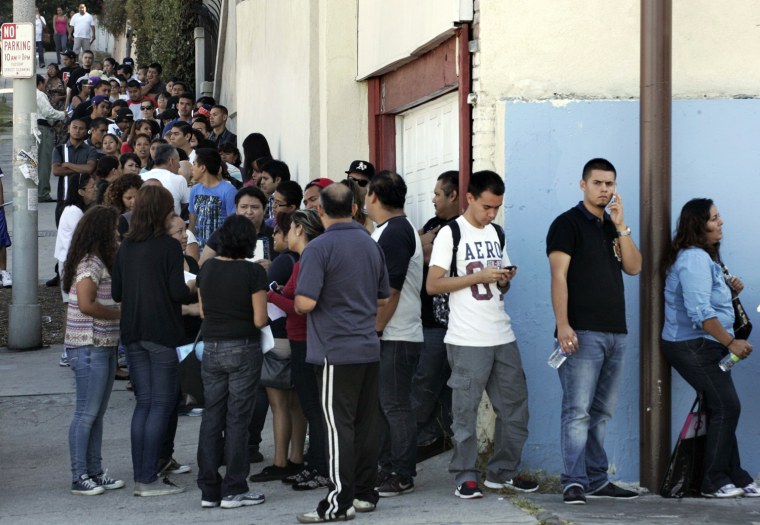 People line up for assistance with paperwork for the Deferred Action for Childhood Arrivals program at the Coalition for Humane Immigrant Rights of Los Angeles in Los Angeles, California, August 15. The U.S. government began accepting applications on Wednesday from young illegal immigrants seeking temporary legal status under relaxed deportation rules announced by the Obama administration in June.