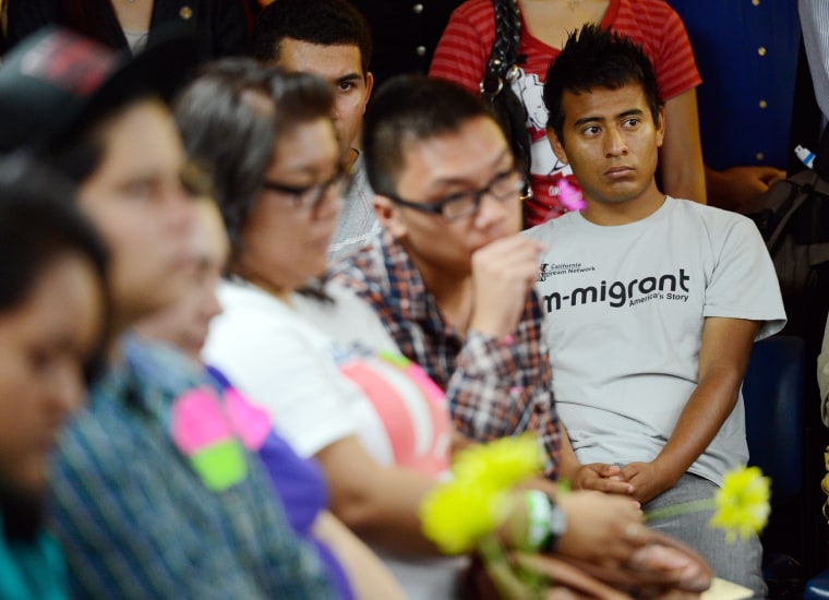 A group of immigrants, known as DREAMers, hold flowers as they listen to a news conference to kick off a new program called Deferred Action for Childhood Arrivals at the Coalition for Humane Immigrant Rights of Los Angeles on August 15, 2012 in Los Angeles, California. Under a new program established by the Obama administration undocumented youth who qualify for the program, called Deferred Action for Childhood Arrivals, can file applications from the U.S. Citizenship and Immigration Services website to avoid deportation and obtain the right to work
