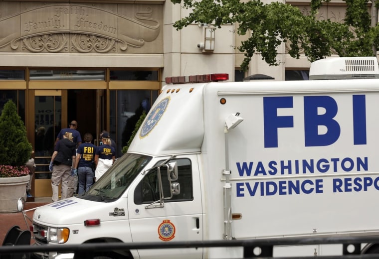 Members of the FBI enter the Family Research Council office after a shooting Wednesday in Washington, D.C.