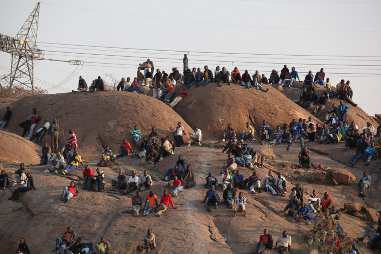Striking miners gather on a hillside at the Lonmin mine near Marikana, South Africa on Aug. 15.