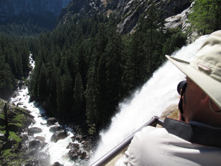 A hiker takes a photo from the top of Vernal Fall in Yosemite in July 2011.