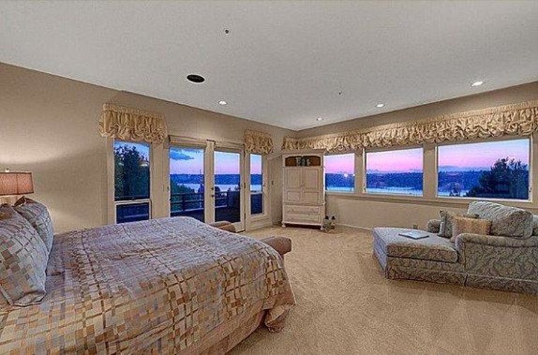 The large master suite features views of the water.
