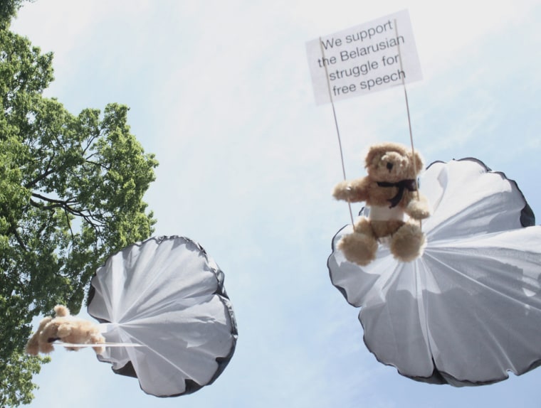 Teddy bears parachute over a residential area in Minsk, Belarus on July 4, 2012.