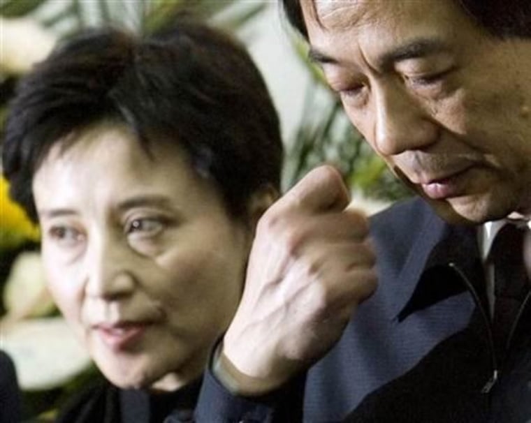 Former Chinese Commerce Minister Bo Xilai, right, and his wife, Gu Kailai, at a government ceremony in Beijing in 2007.