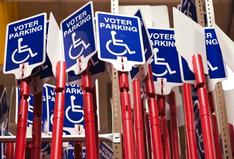 Disabled voter parking signs are stored inside the Maricopa County Elections Department warehouse in Phoenix, Ariz. At a time when 37 states have considered photo ID legislation, some disabled and elderly Americans may face difficulty voting this November because they often don't have a valid driver's license. The result is that voter turnout among these groups probably will decrease, according to Rutgers University research.